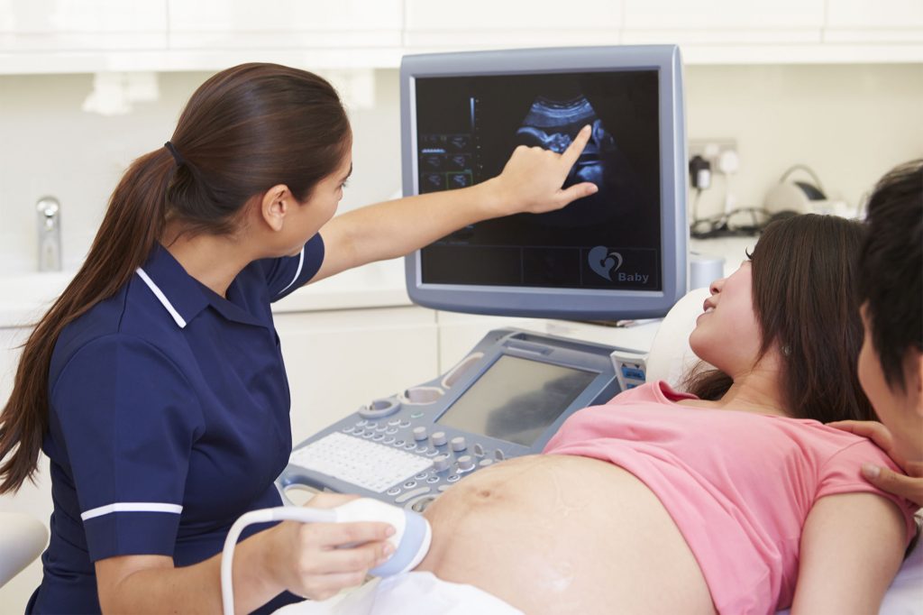 Early Pregnancy Reassurance Scan - couple at ultrasound